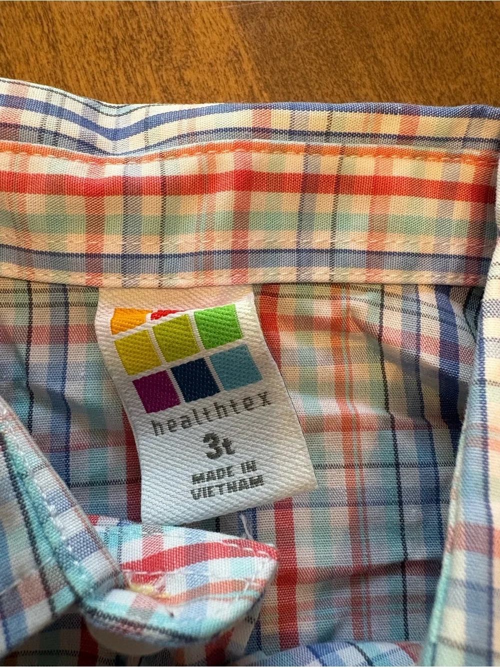 healthtex Navy Blue Garment with Colorful Logo Tag